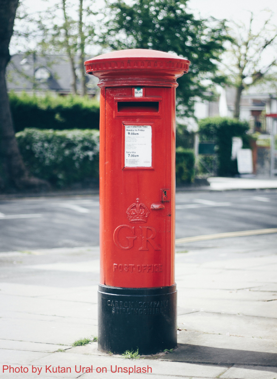 A photo of a red British post box