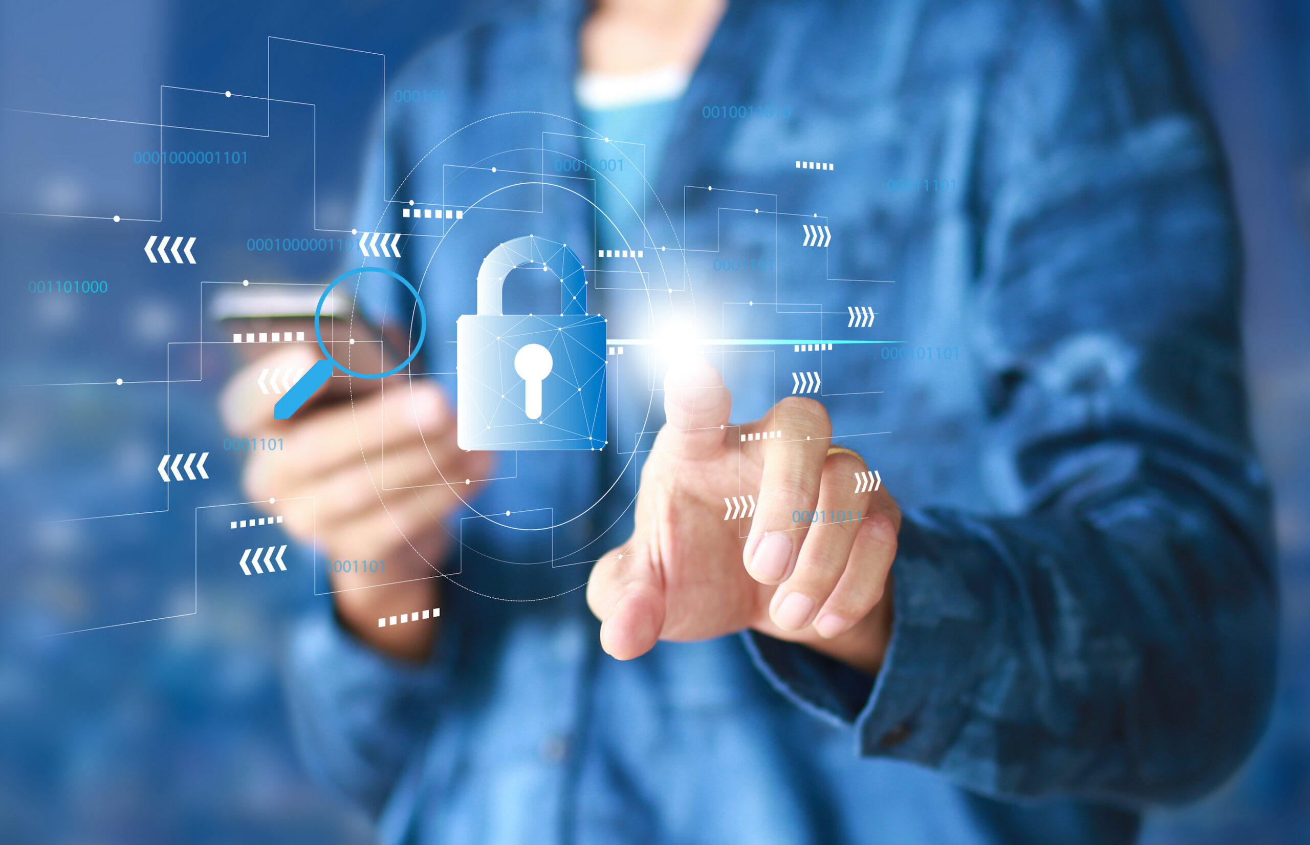 Digital security concept. A person dressed in blue touches their finger to a virtual lock © Adobe Stock
